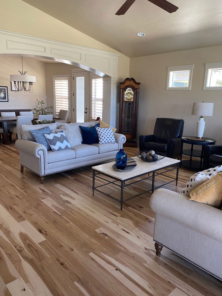 light and dark mixed hickory hardwood floors in furnished living room
