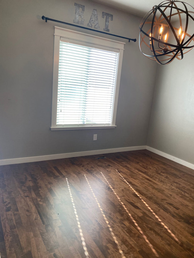dark brown hardwood floors in bedroom