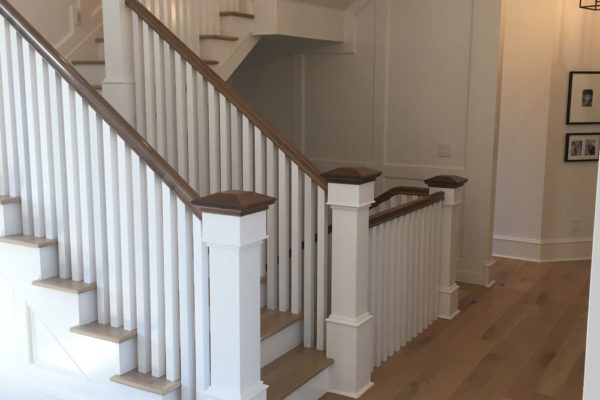 light oak hardwood floors near updated staircase