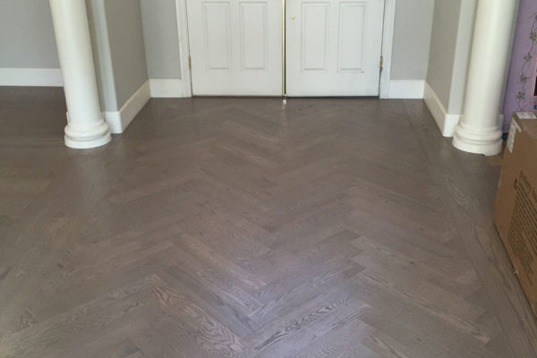 patterned oak hardwood floor in entry way