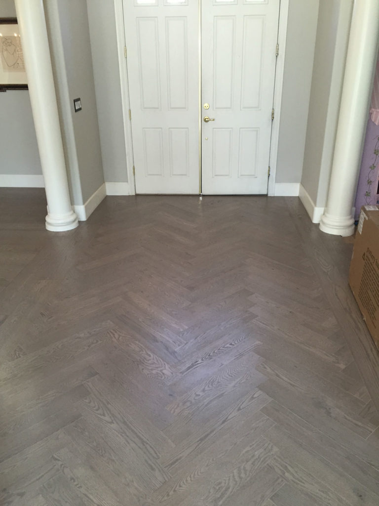 patterned oak hardwood floor in entry way